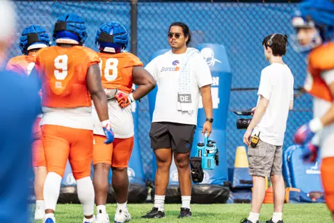 A look at some of the football support staff members working during a fall camp practice. Photo by Kenna Harbison