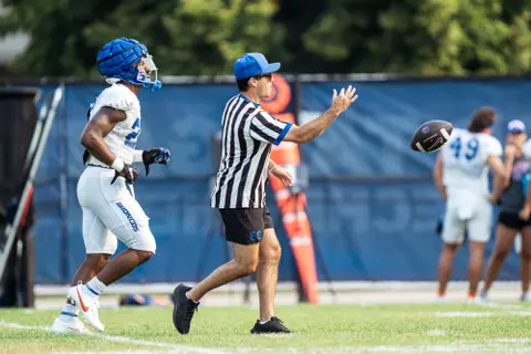 A look at some of the football support staff members working during a fall camp practice. Photo by Kenna Harbison