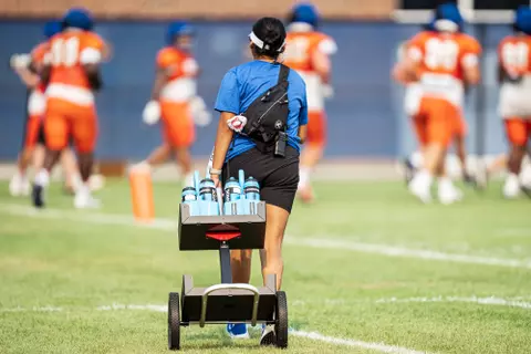 A look at some of the football support staff members working during a fall camp practice. Photo by Kenna Harbison