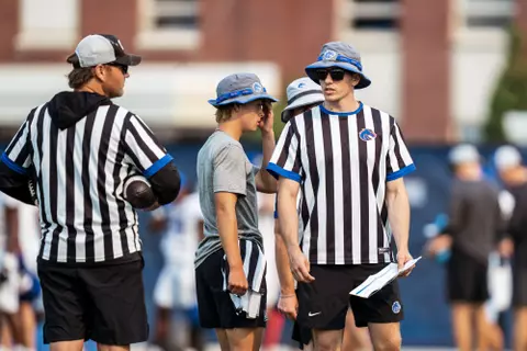 A look at some of the football support staff members working during a fall camp practice. Photo by Kenna Harbison