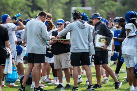 A look at some of the football support staff members working during a fall camp practice. Photo by Kenna Harbison