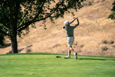 Jake Slocum tees off during a fall practice at Crane Creek Country Club.