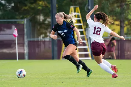 Kaitlyn Slocum running after the ball.