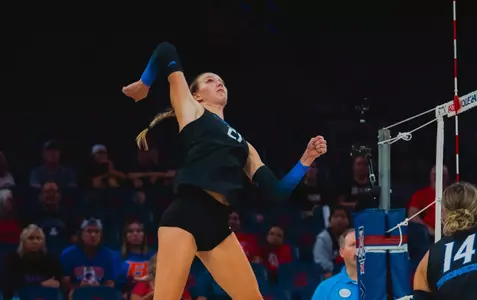 Paige Bartsch going high to attack the ball against VCU in 2024.