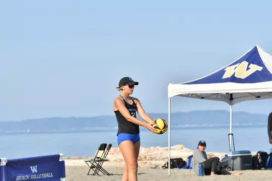 Lily Patock preparing to serve at Washington