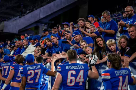 Boise State fans high five players after the game in a 45-24 win over Washington State at Albertsons Stadium on Sept. 28, 2024 (Photo by Kenna Harbison)