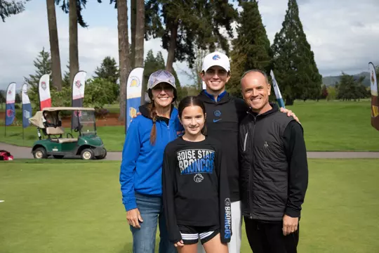 Cole Rueck stands with his family after winning the 2024 MW title