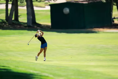 Teal Matsueda swinging from the fairway at a 2024 practice