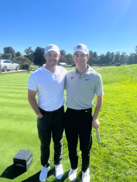 Cole Rueck poses with Rory McIlroy after winning the Genesis Collegiate Showcase