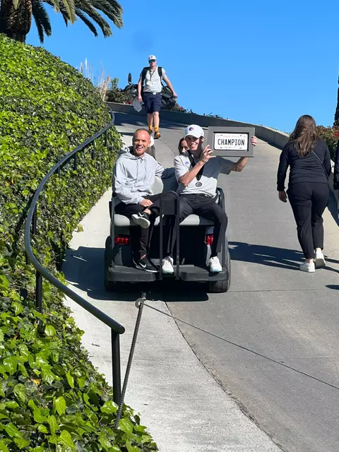 Cole Rueck rides with his parents to the clubhouse after winning the Genesis Collegiate Showcase