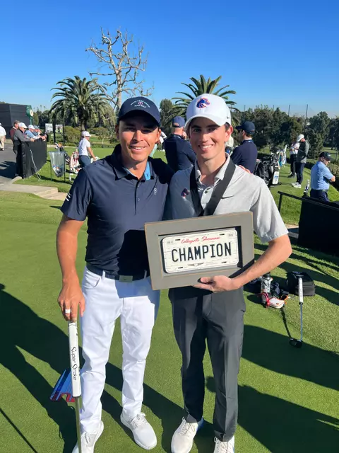 Cole Rueck poses with Rickie Fowler after winning the Genesis Collegiate Showcase
