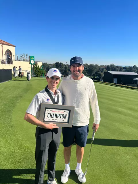 Cole Rueck poses with Scottie Scheffler after winning the Genesis Collegiate Showcase.