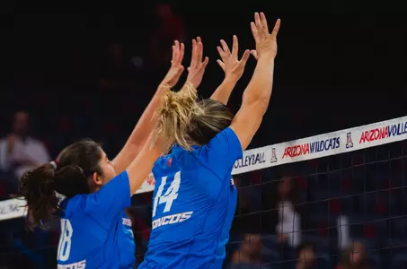 Anabel Kotzakov and Annie Kaminski block a shot at Arizona on August 30, 2024.