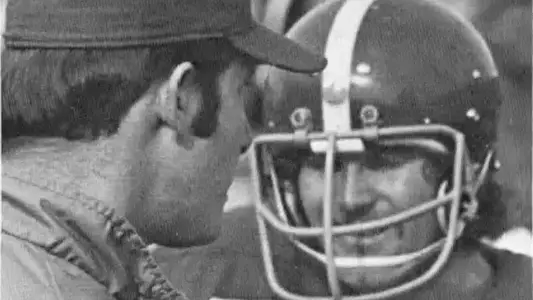 Unknown coach and player in 1973 action photo, Boise State Football vs South Dakota