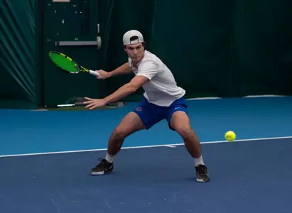 Carson Baker returns a front-hand volley in his win over Idaho State on January 31, 2025.