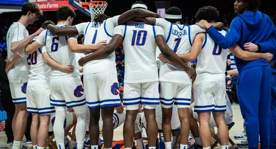 Boise State men's basketball huddles before game against Nevada