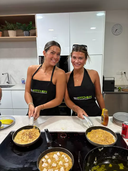 Bridey O'Connor and Addison Wolden cooking.