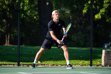 Adam Duda preparing for a serve