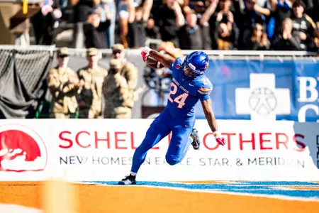 Dylan Riley celebrates after scoring a touchdown vs. UNLV