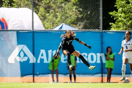 Ava de Leest jumps in the air.