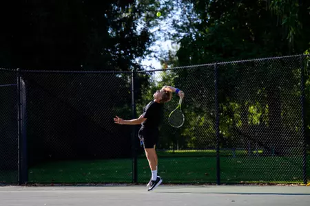 Lukas Velik hitting a serve