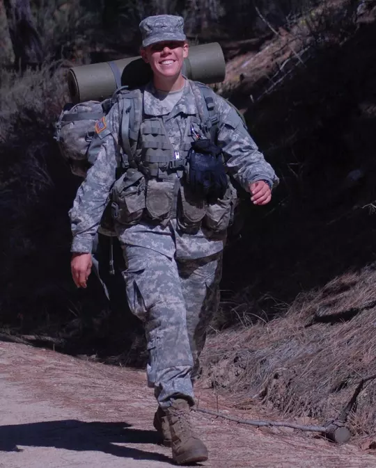 Corey Patton Lossner walking in her Army uniform.