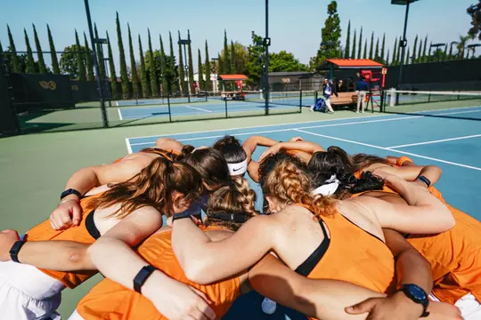 Corey Patton Lossner huddled with her teammates.