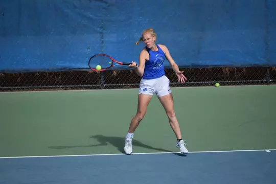 Corey Patton Lossner playing tennis.