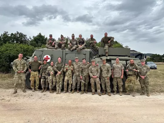 Corey Patton Lossner with her Army group.