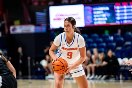 Libby Hutton holds a basketball against Eastern Oregon.