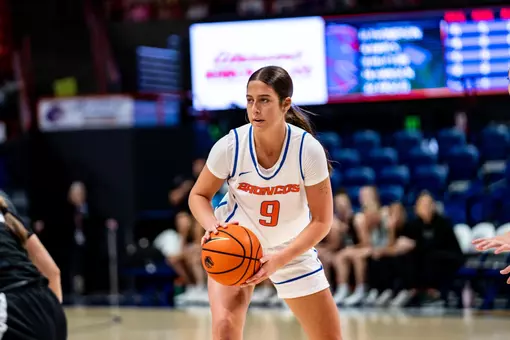 Libby Hutton holds a basketball against Eastern Oregon.
