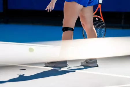 Players legs dropping a ball