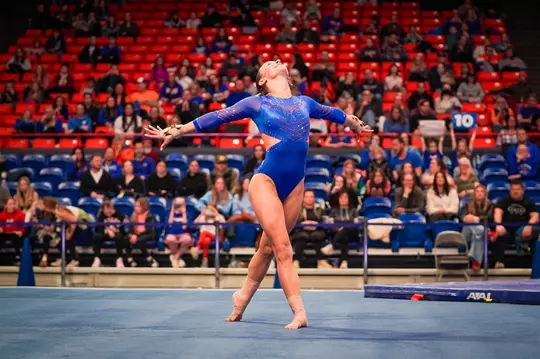 Anna Ferguson doing a gymnastics routine.