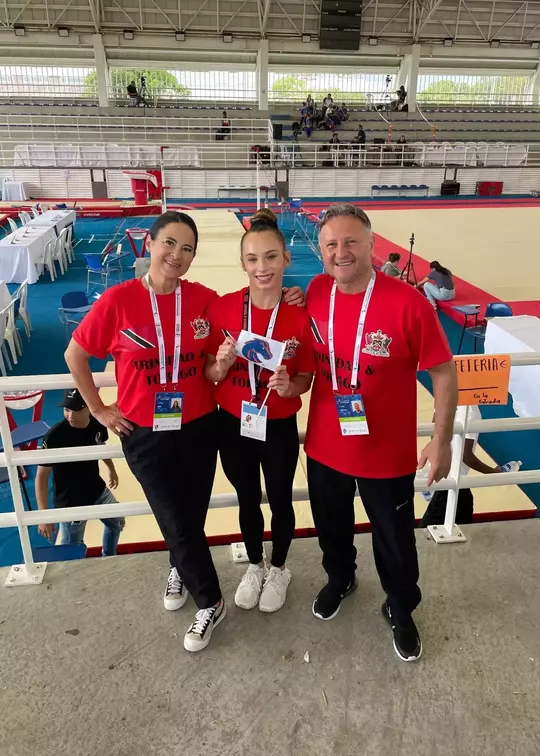 Anna Ferguson with Gymnastics coaches Tina Bird and Ivan Alexov.