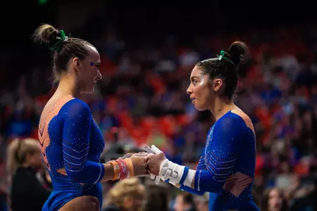 Emily Lopez and Kristina Shchennikova fist pumping between routines.