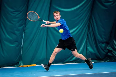 Lukas Velik uses his fore hand to return a shot against Michigan State on Feb. 9, 2025.
