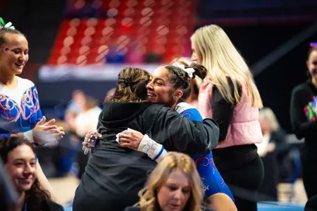 Emily Lopez celebrating after her bars routine.