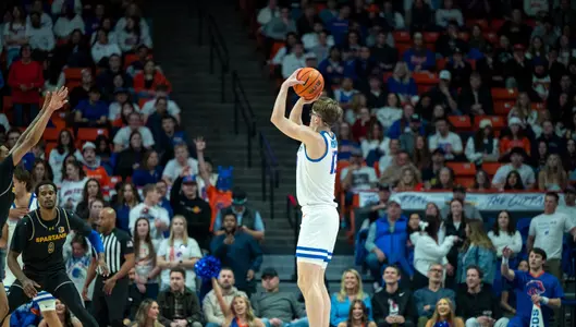 Andrew Meadow attempts a three-point shot on the right wing against San Jose State