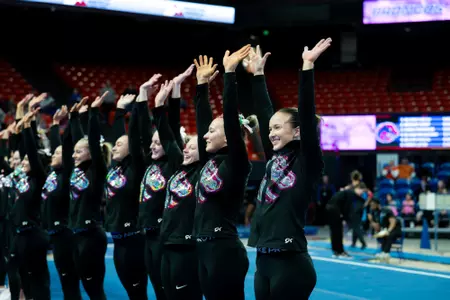 Boise State gymnastics team waving.