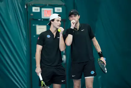 Carson Baker and Jett Middleton talk during their doubles match against Idaho State on January 31, 2025.