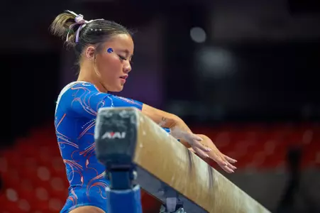 Emma Loyim preparing to begin her beam routine.