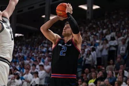 Tyson Degenhart attempts a jump shot on the road against Utah State