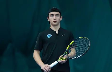 Dylan Jaen taking in the action and holding his racquet during the Eastern Washington match on January 31, 2025.