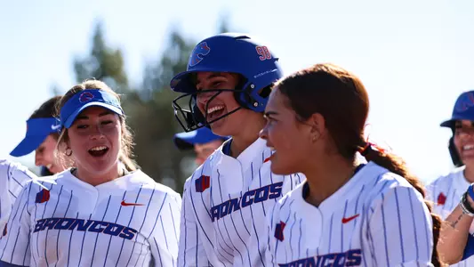 Makenzie Butt celebrates a home run.