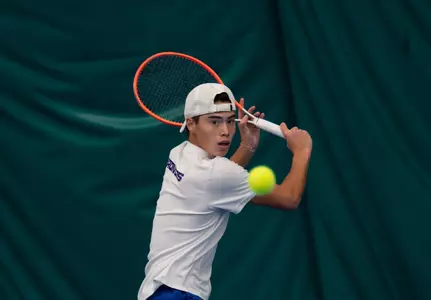 James Van Herzeele stares down the ball as he prepares to hit it with a backhand volley against Idaho State on January 31, 2025.