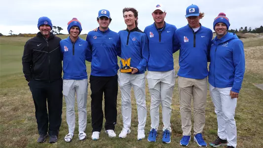Men's golf team photo with runner-up trophy at Bandon Dunes.