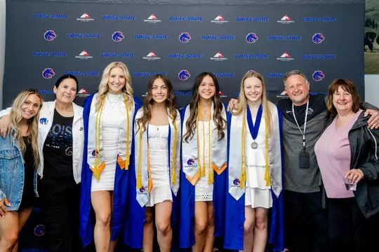 Gymnastics coaches at student-athlete graduation