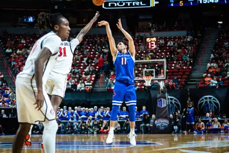 Alvaro Cardenas attempts a three-pointer against San Diego State