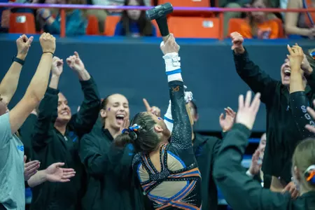 Emily Lopez celebrating with the hammer.
