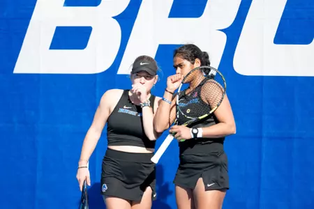 Paula Schaefer and Bhakti Shah talking between points